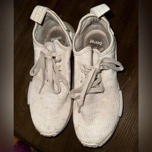 Worn adidas NMDs sneakers
